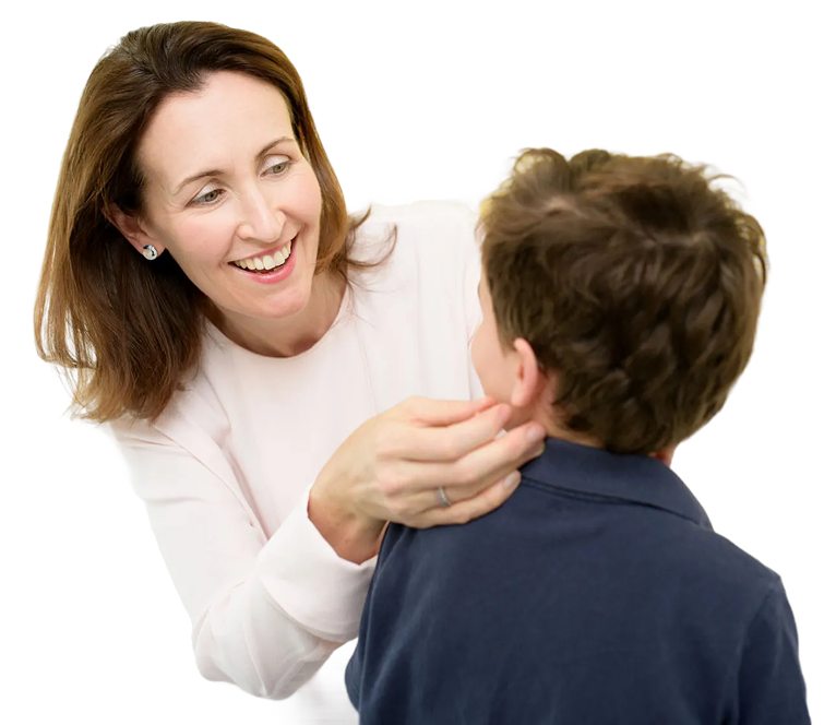 Dr Susan smiling while examining a child